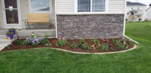 mulch and flower bed in well-landscaped yard