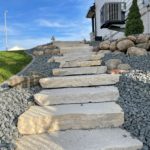 stone steps in a meticulously landscaped yard