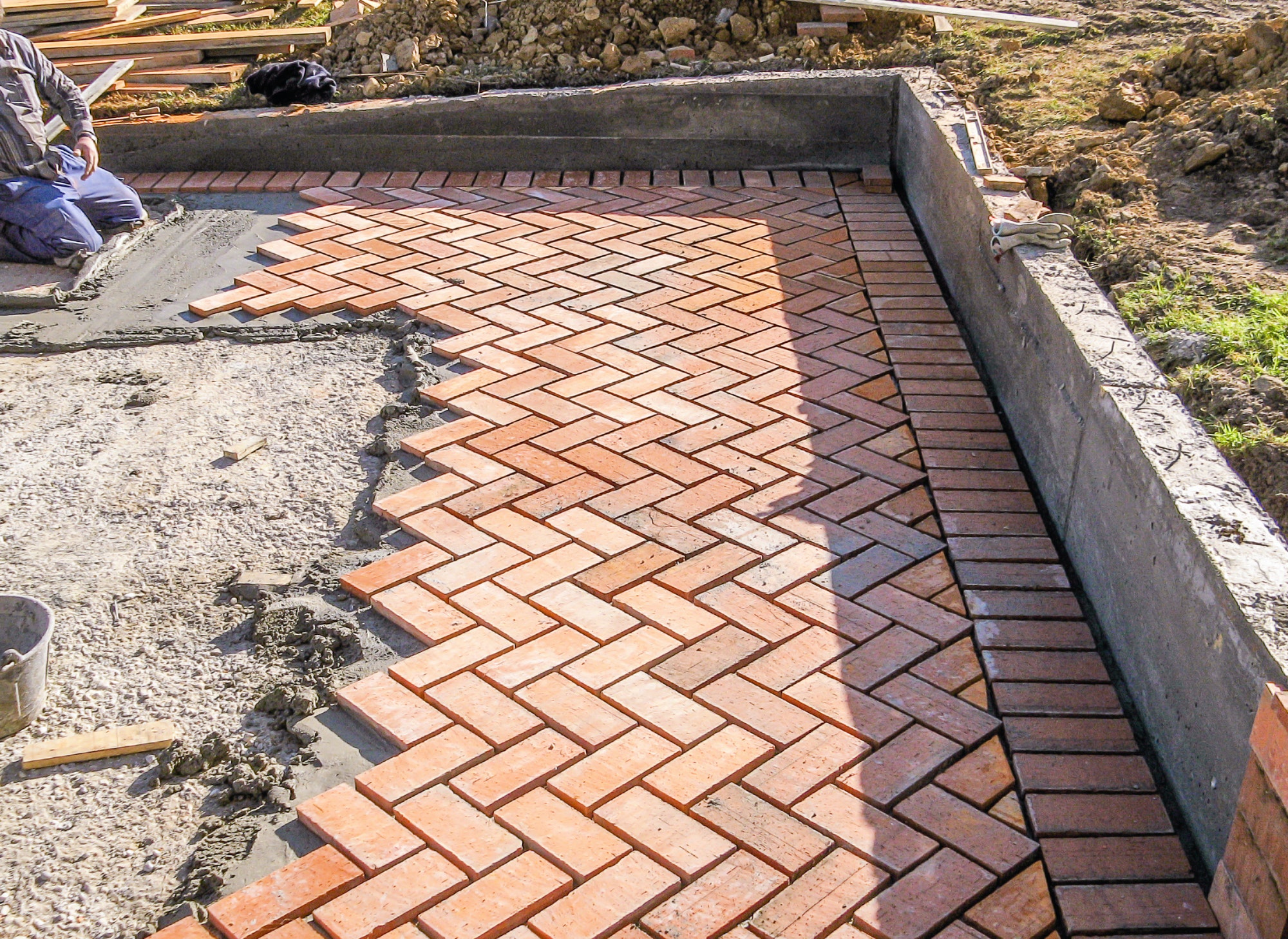 Orange brick paving stones in construction process