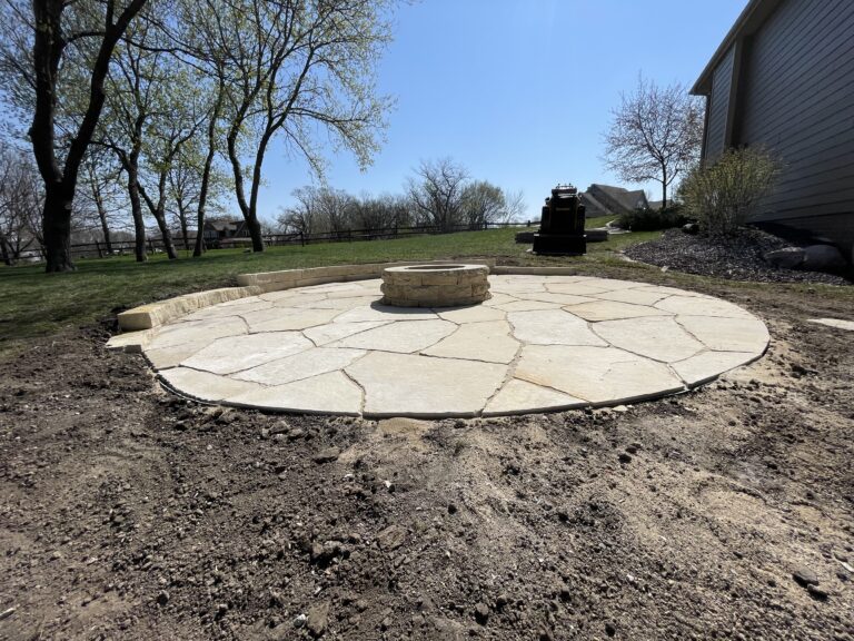 A Natural Stone Patio in Huxley That Blends with the Landscape